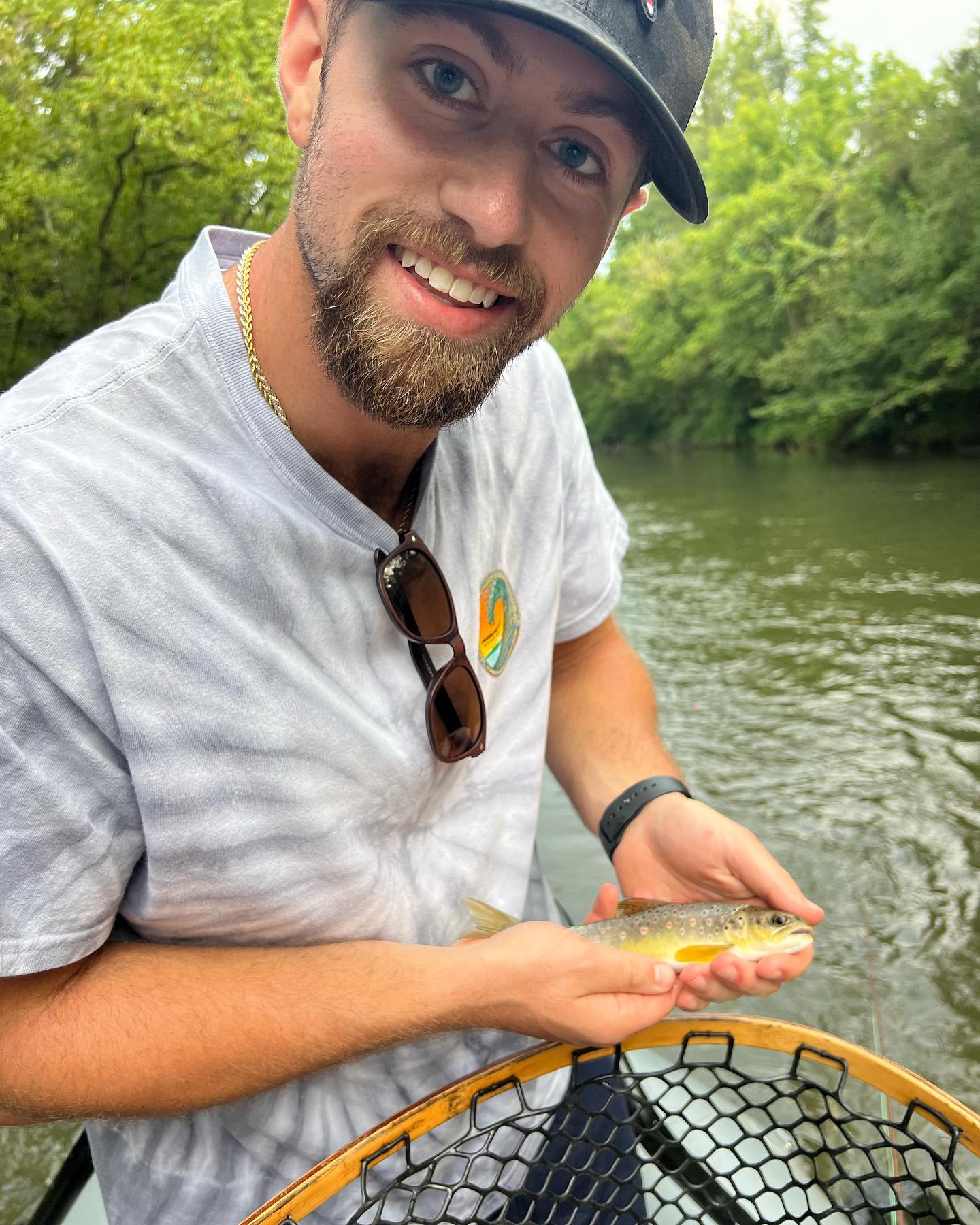 Angler with a sea trout fish in Bassett