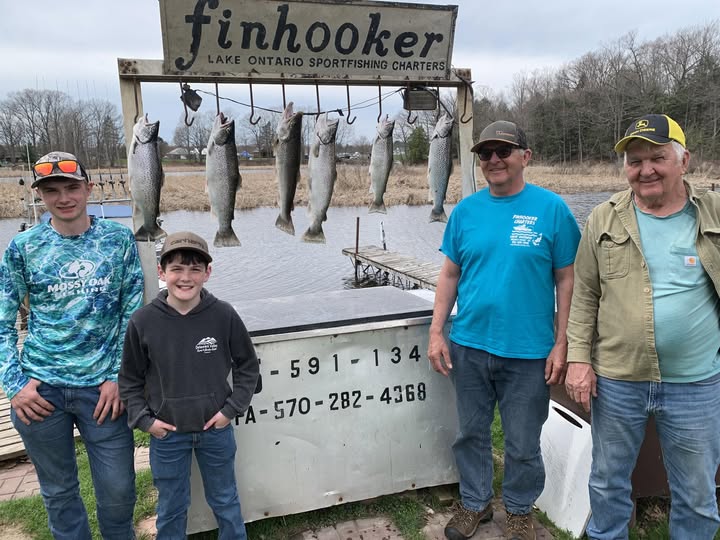 Six coho salmon displayed on charter boat cleaning station at Finhooker Lake Ontario Sportfishing Charters in Mexico NY