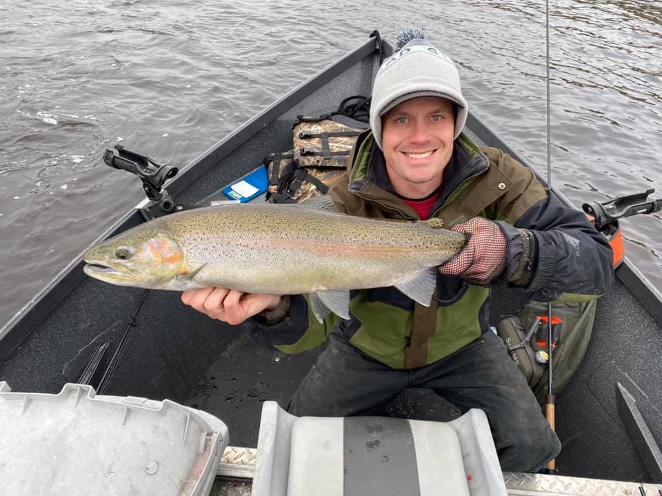 Fisherman catches a big rainbow trout in NY