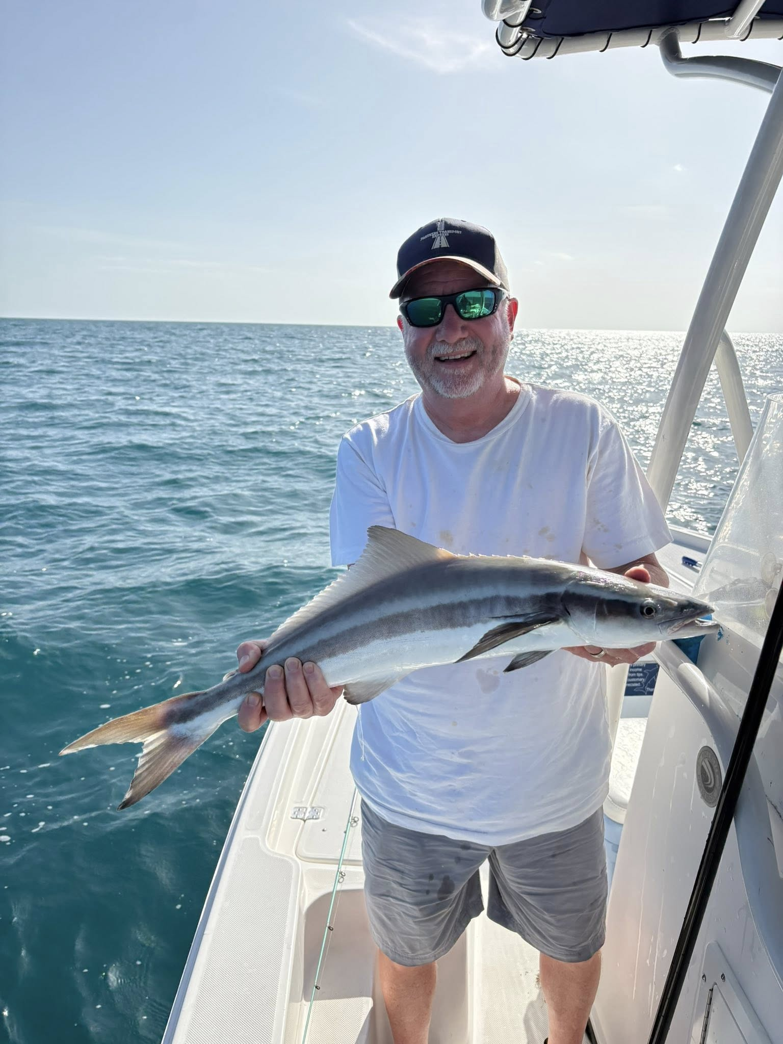 A fisherman catching a cobia in Key West, Florida
