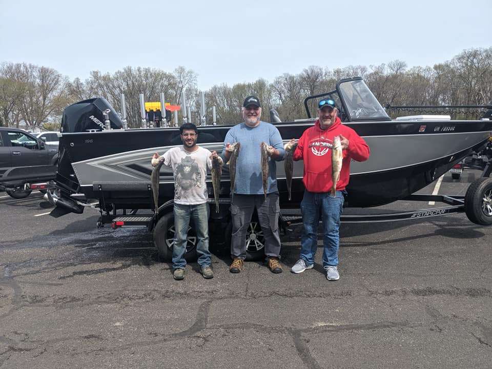Three anglers casting lines at a scenic lakeside location in Lakeside Marblehead