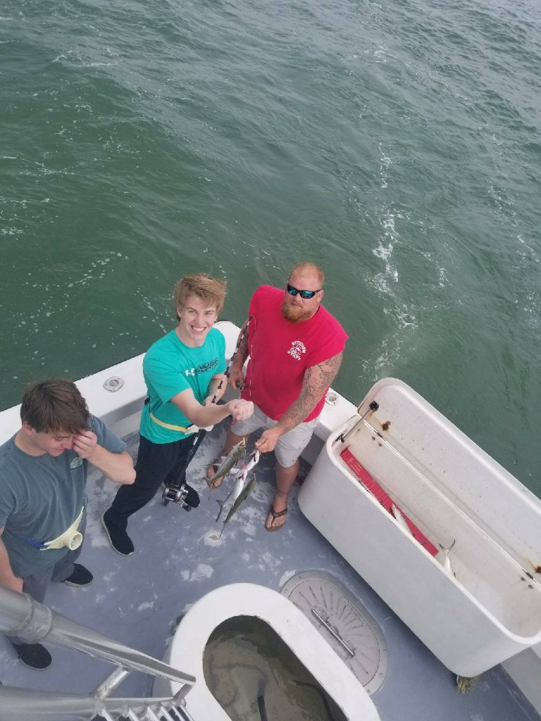 Three people enjoying a day in Destin