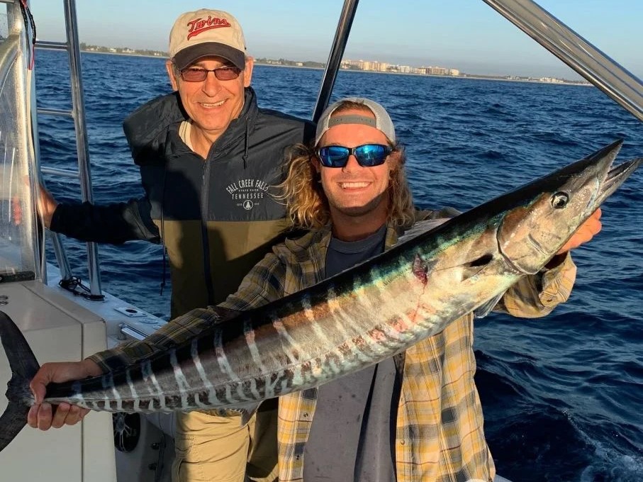 Wahoo fish caught by two people at Pompano Beach