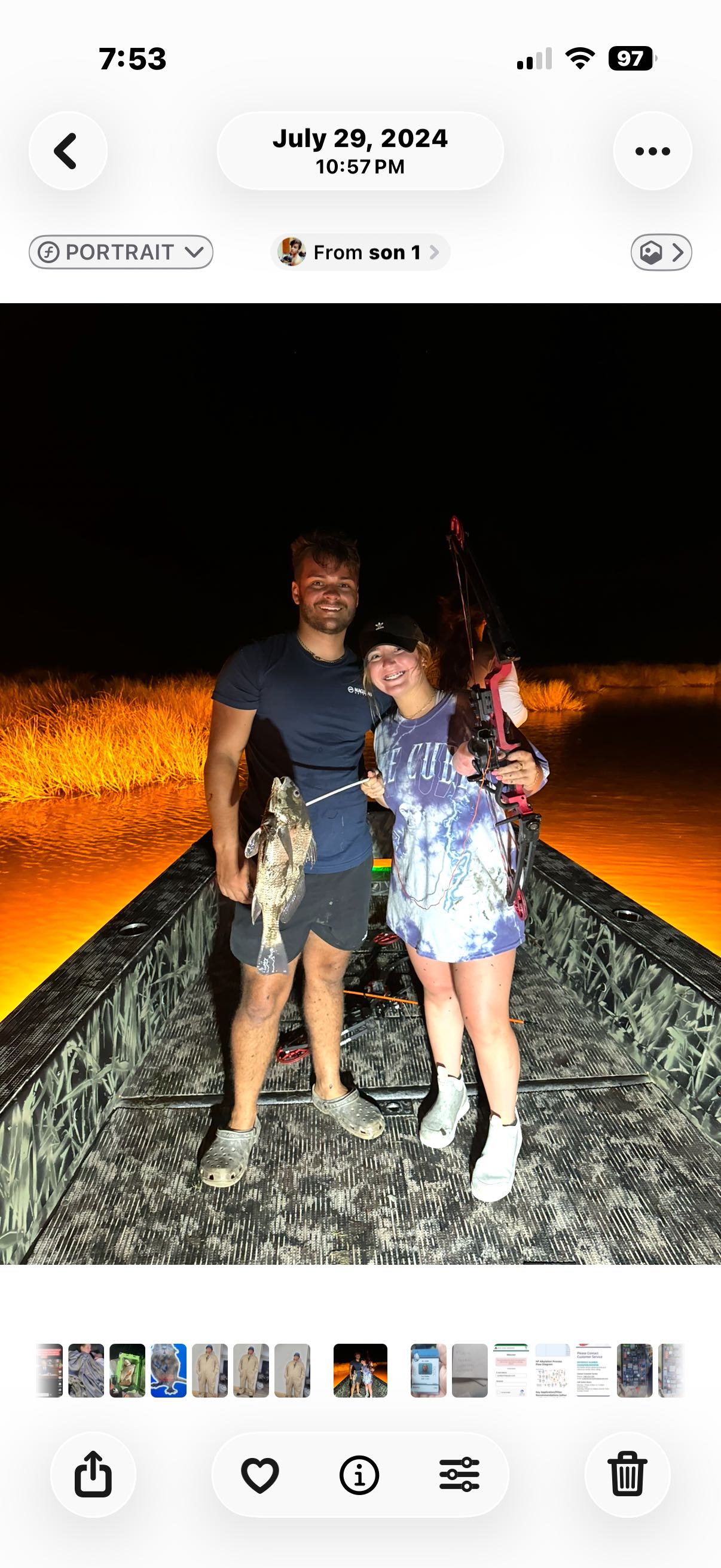 Night fishing scene with bow fishing equipment and caught fish in Lafitte LA