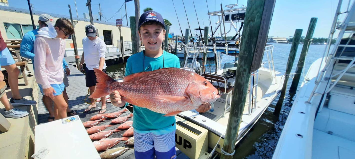 4 people fishing with a big 46-inch fish in FL