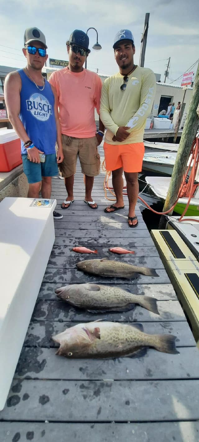 Three anglers with big fish in Florida