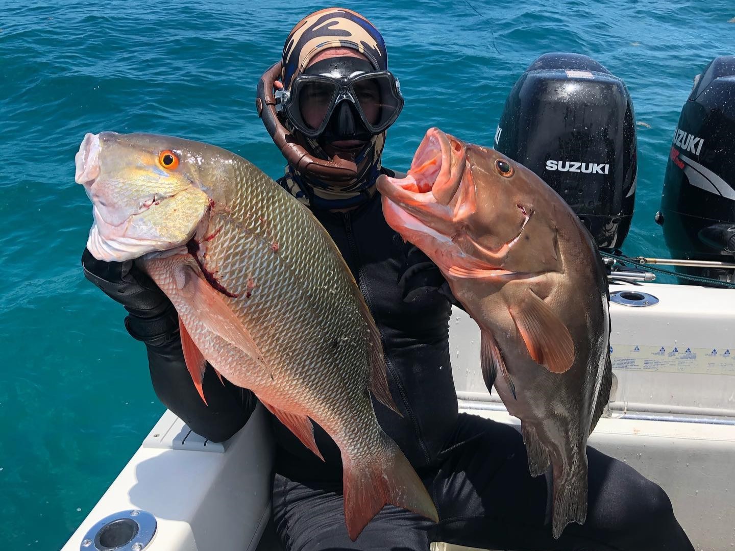 Two anglers fishing in Coral Gables with 16-inch fish