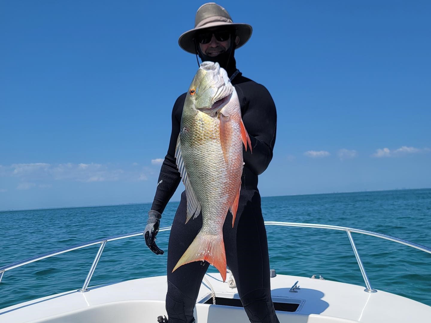Angler holds a large catch in Coral Gables
