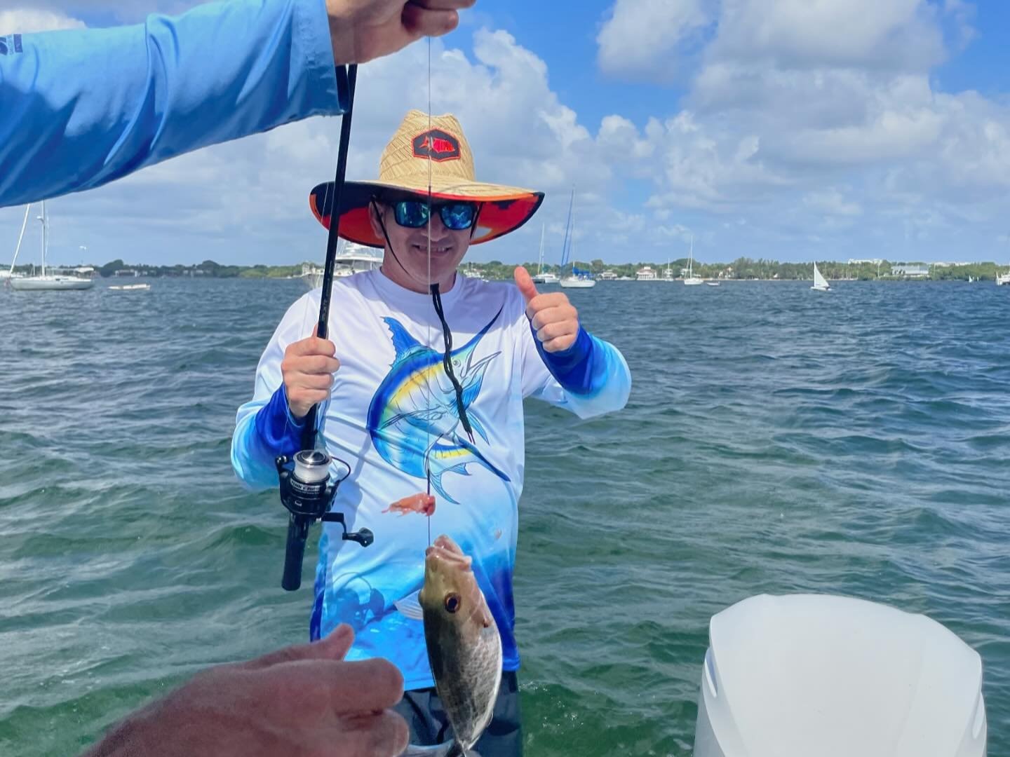A lone fisherman reeling in a catch in Florida
