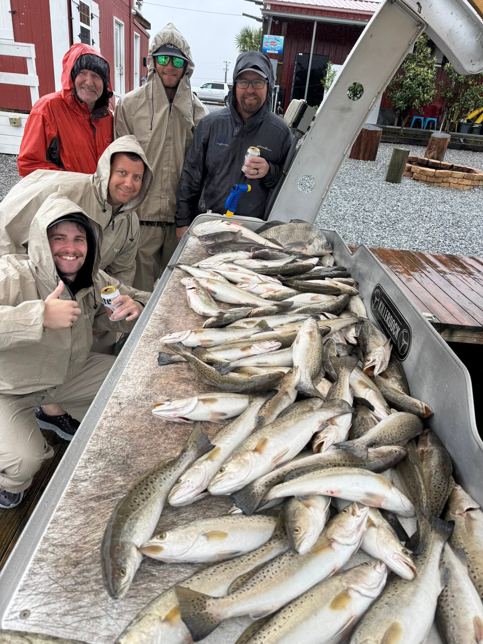 Fishing charter catch of speckled trout displayed on cleaning table in Slidell Louisiana
