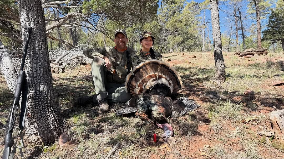 Successful turkey hunting scene in Scottsdale AZ forest with harvested wild turkey