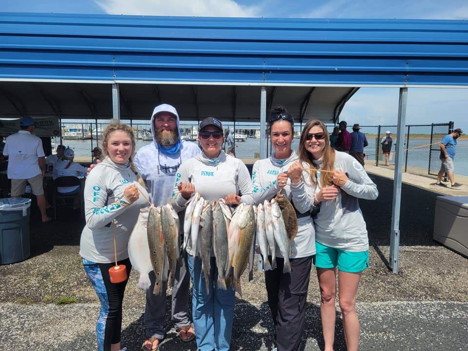 Two fish caught by six people in Galveston