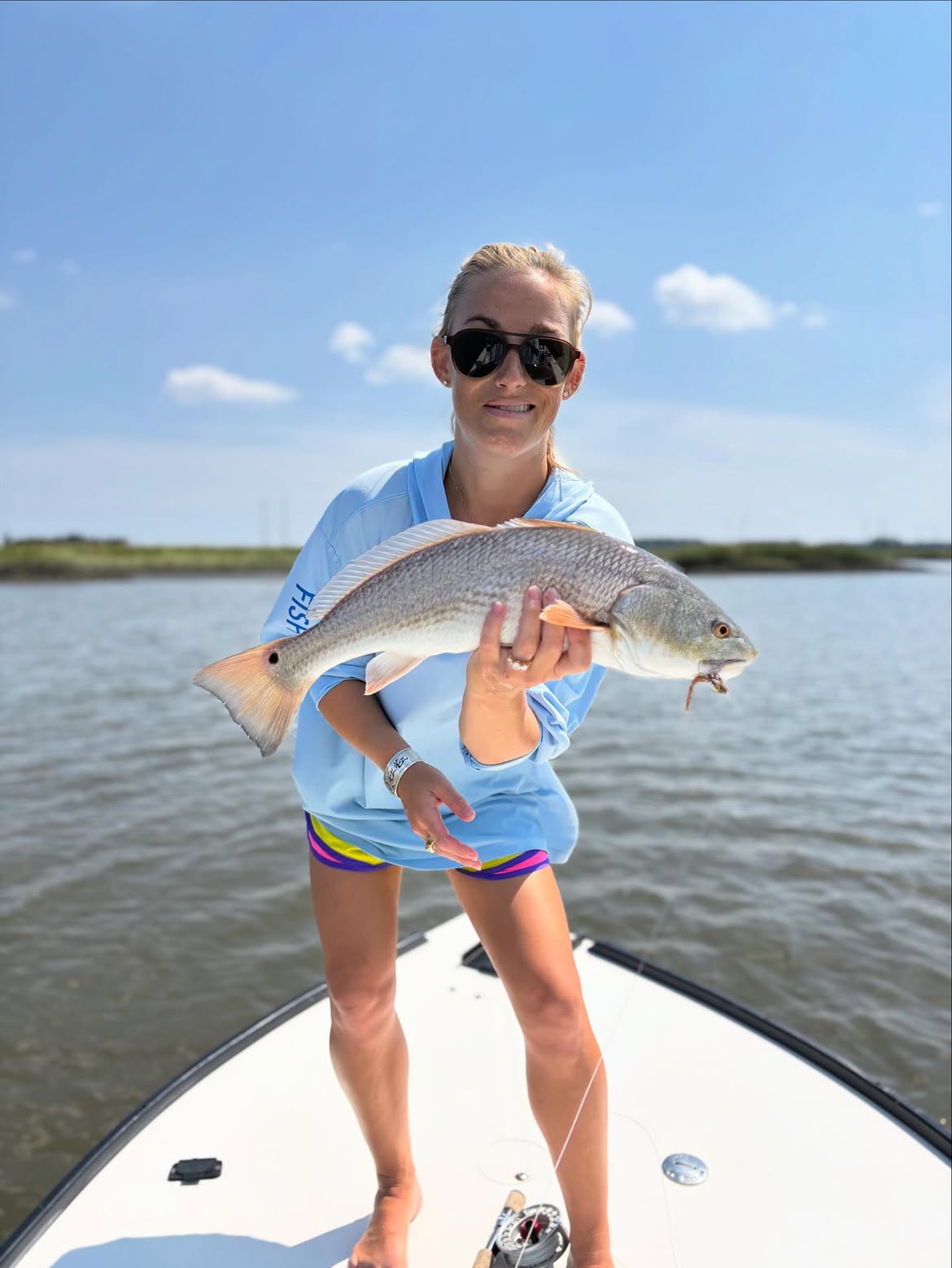 Redfish catch while fishing in Mt Pleasant SC with fishing rod and reel