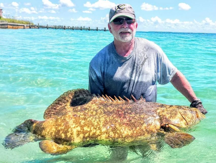 A person holding a fishing rod in North Fort Myers