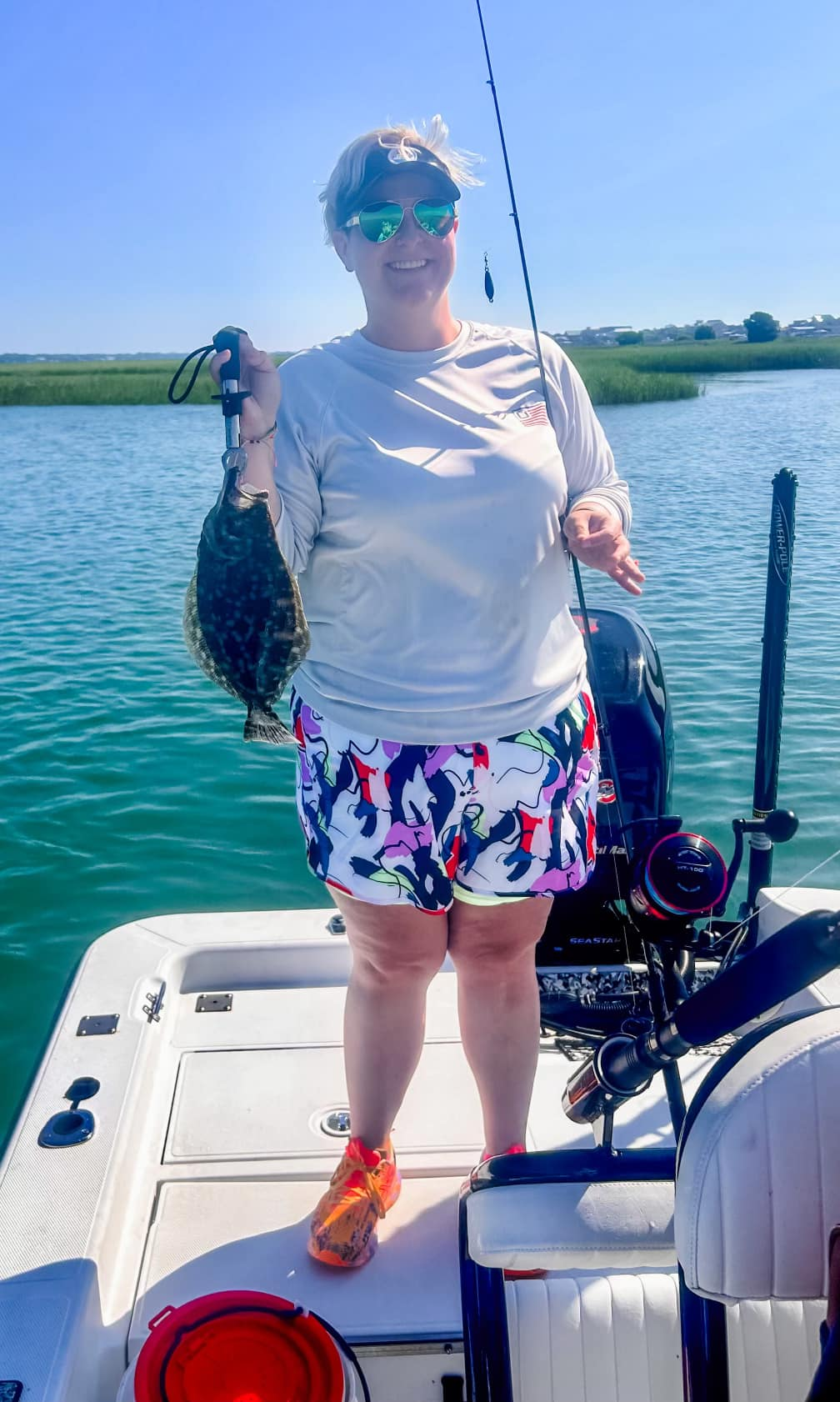 A fisherman holding a Southern Flounder in Murrells Inlet