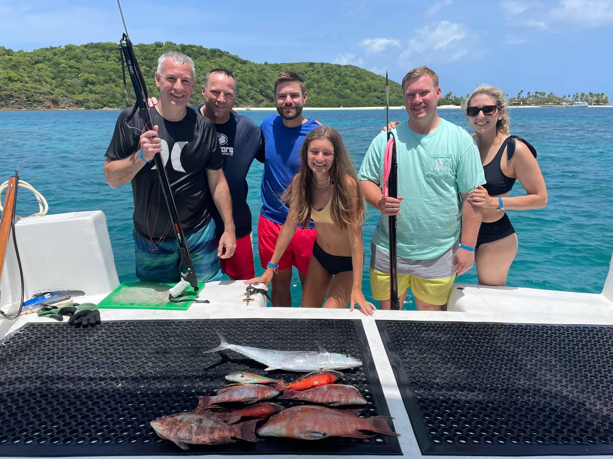 3 fishing rods with 6 people in the background in PR