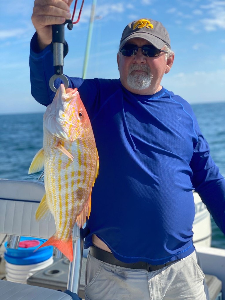 One person fishing at New Smyrna Beach