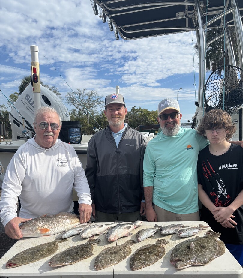 Fishing charter catch display showing redfish and summer flounder from St. Petersburg FL waters