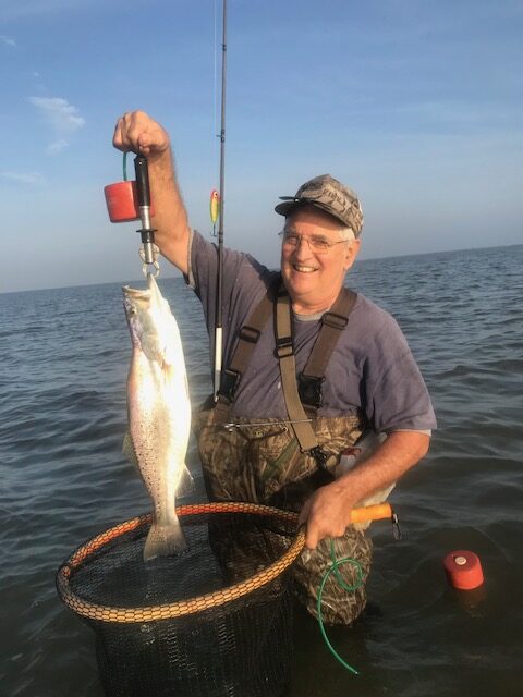 One angler holding a fishing rod in Matagorda
