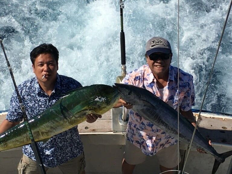 Two people fishing in HI
