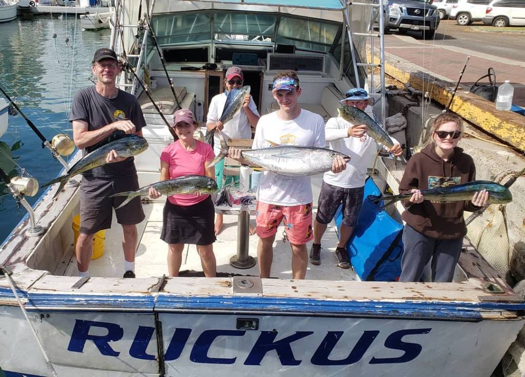 A group of 6 people fishing in Honolulu