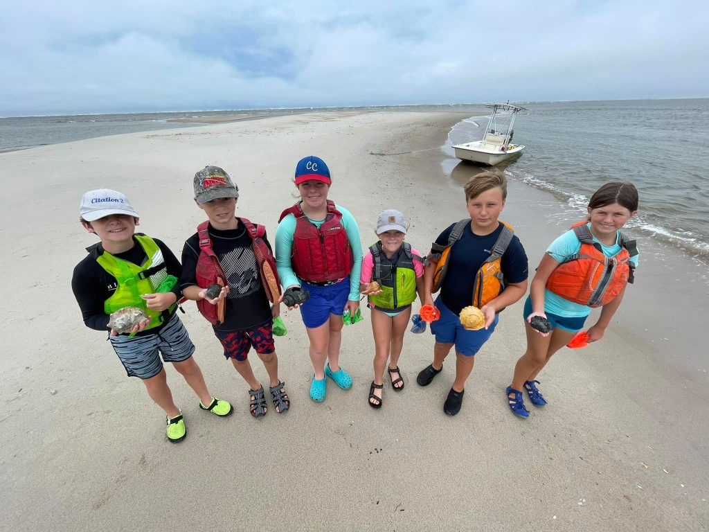 Group of 6 people enjoying outdoor activity in Swansboro