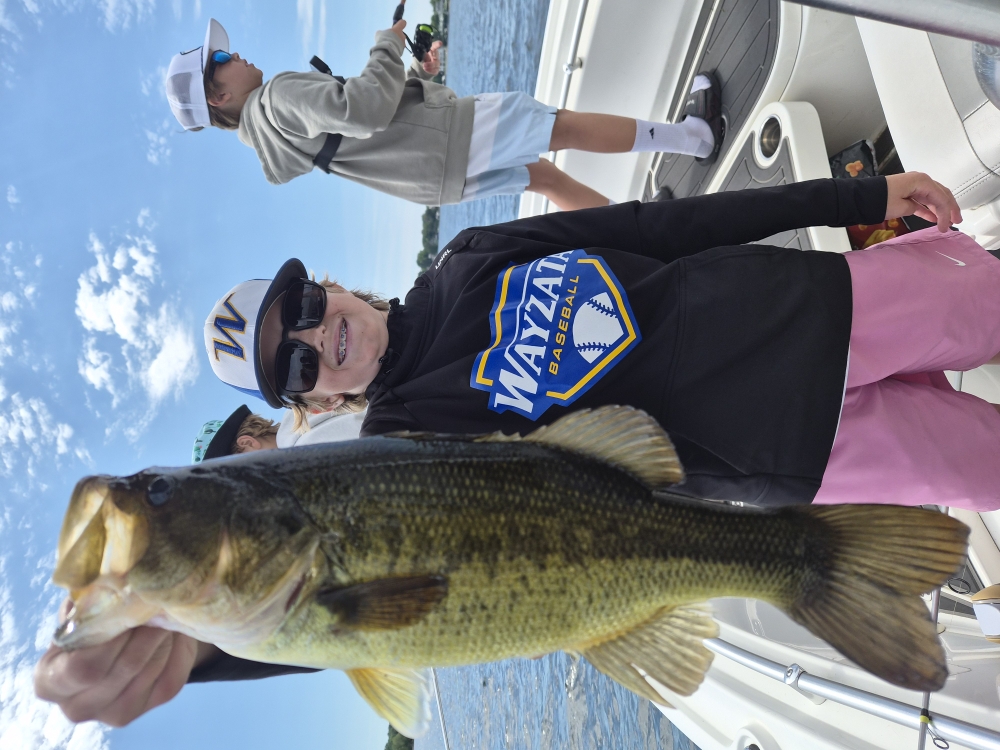 Large bass catch held up on fishing boat in Spring Park MN