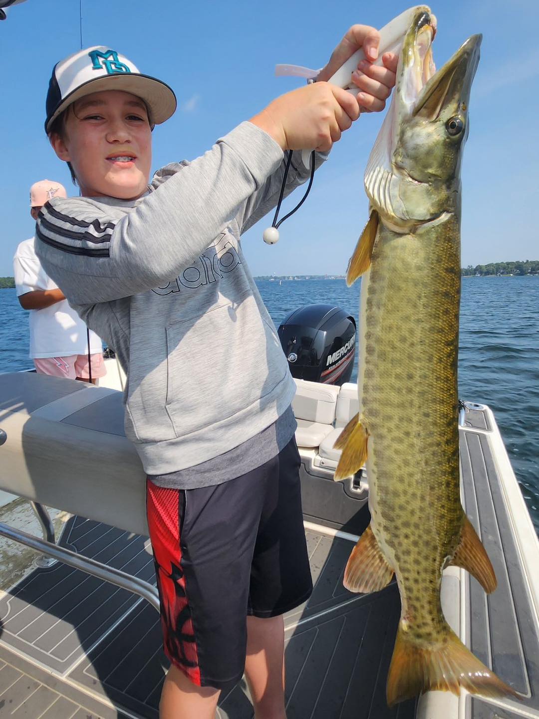 Large muskellunge fish caught on fishing boat in Spring Park MN