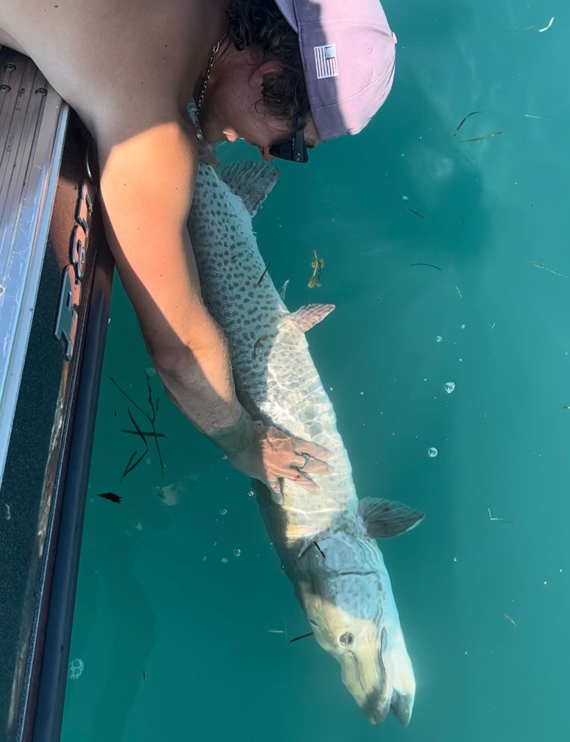 A fisherman's successful catch in Harrison Township
