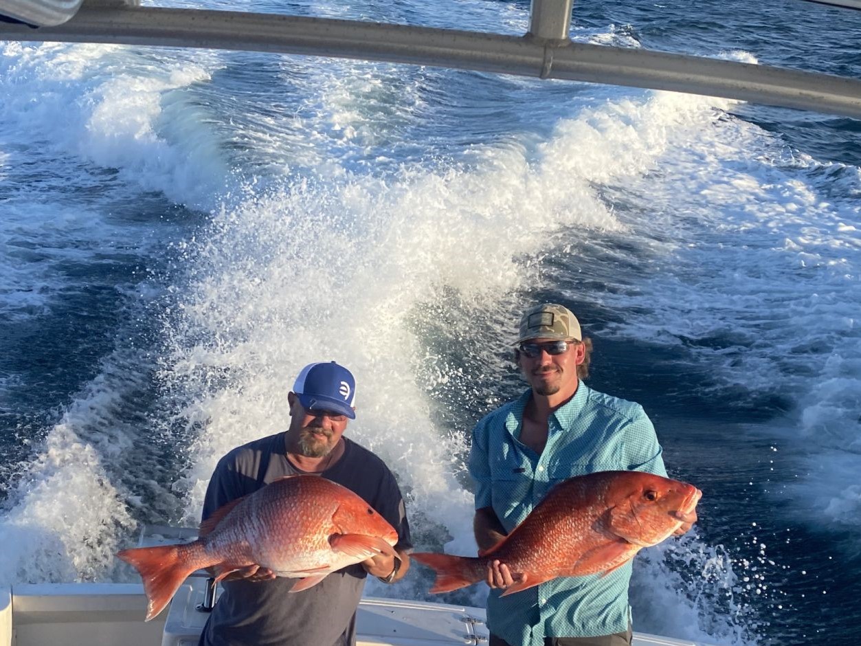 Two anglers with a catch of big fish in Gulf Shores