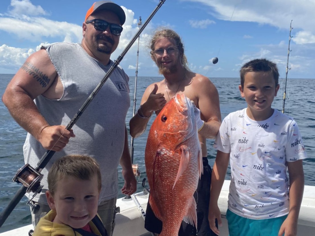 A group of 4 people fishing in AL