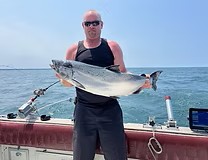 Lake Ontario fishing charter boat with anglers catching salmon and trout on 12-hour trip