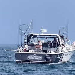 1983 Trojan 36' cruiser boat on Lake Ontario with 13ft beam for 8-hour private cruise