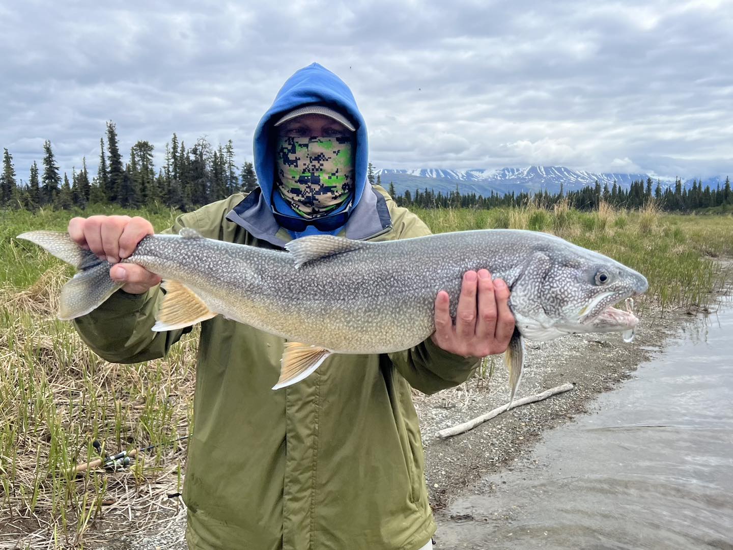 A lone angler fishing in the waters of Alaska