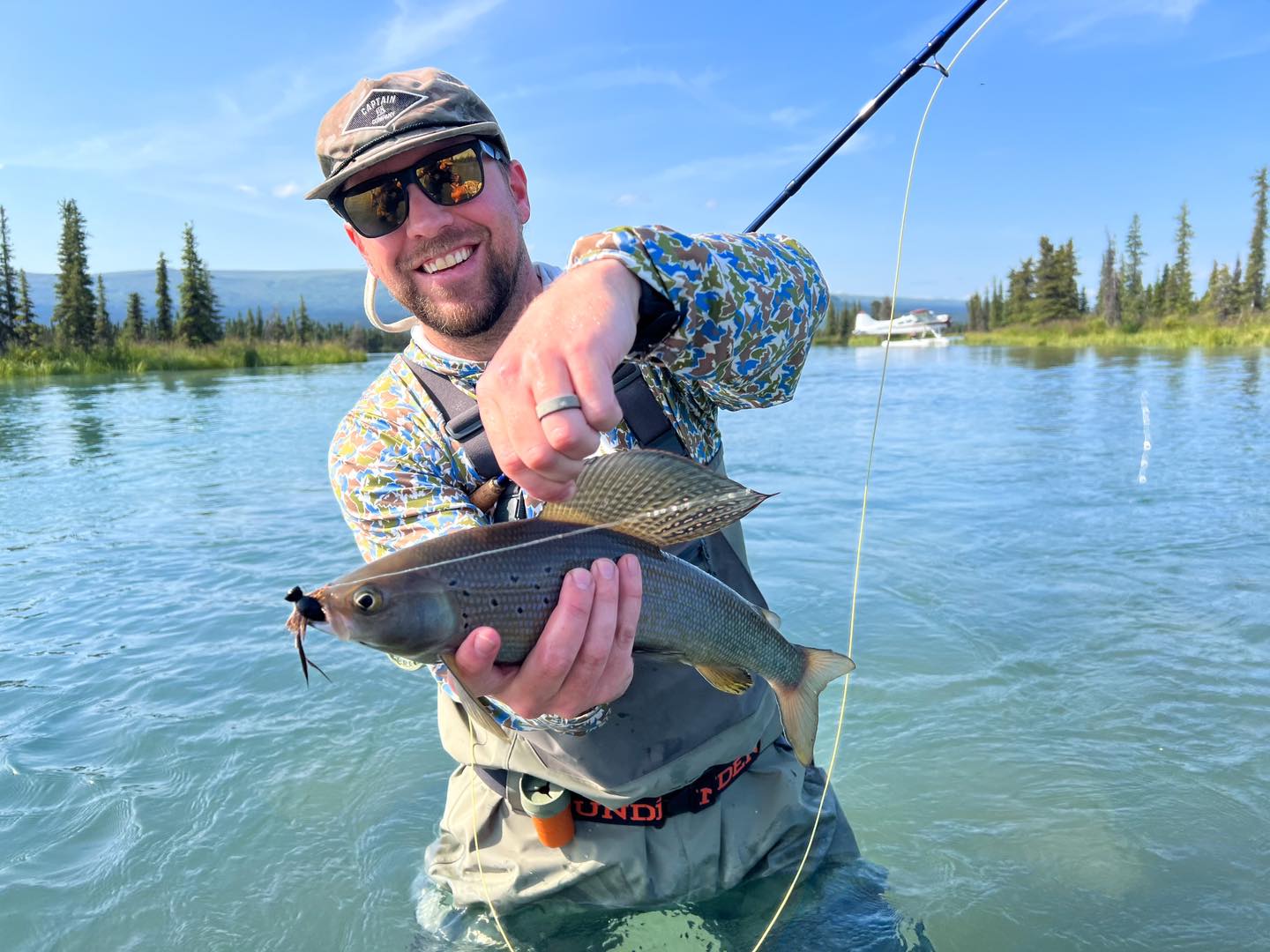 Photograph of a single Arctic Grayling fish caught while fishing in Alaska