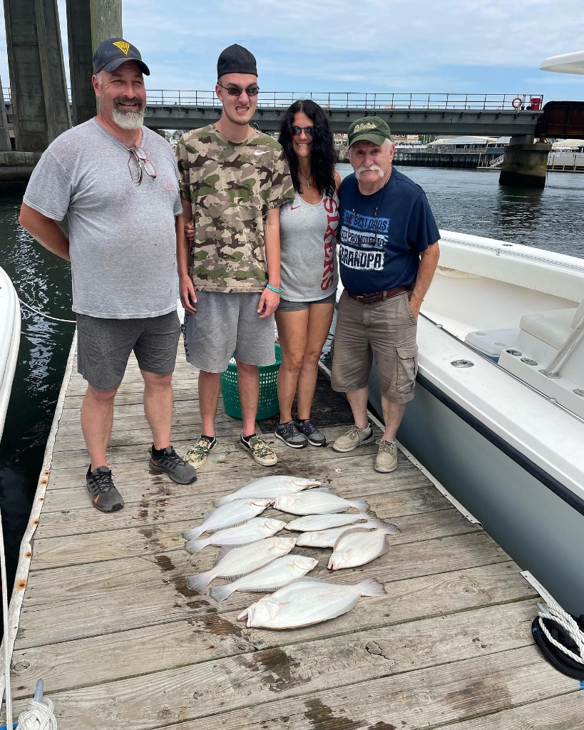 four people enjoying outdoor activity in belmar