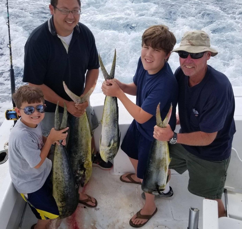 Three Coho Salmon and King Mackerel fish caught in North Carolina