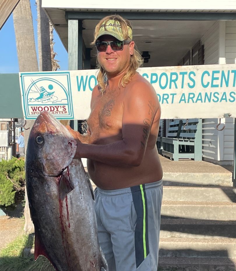 A lone angler reeling in a 22-inch catch in TX
