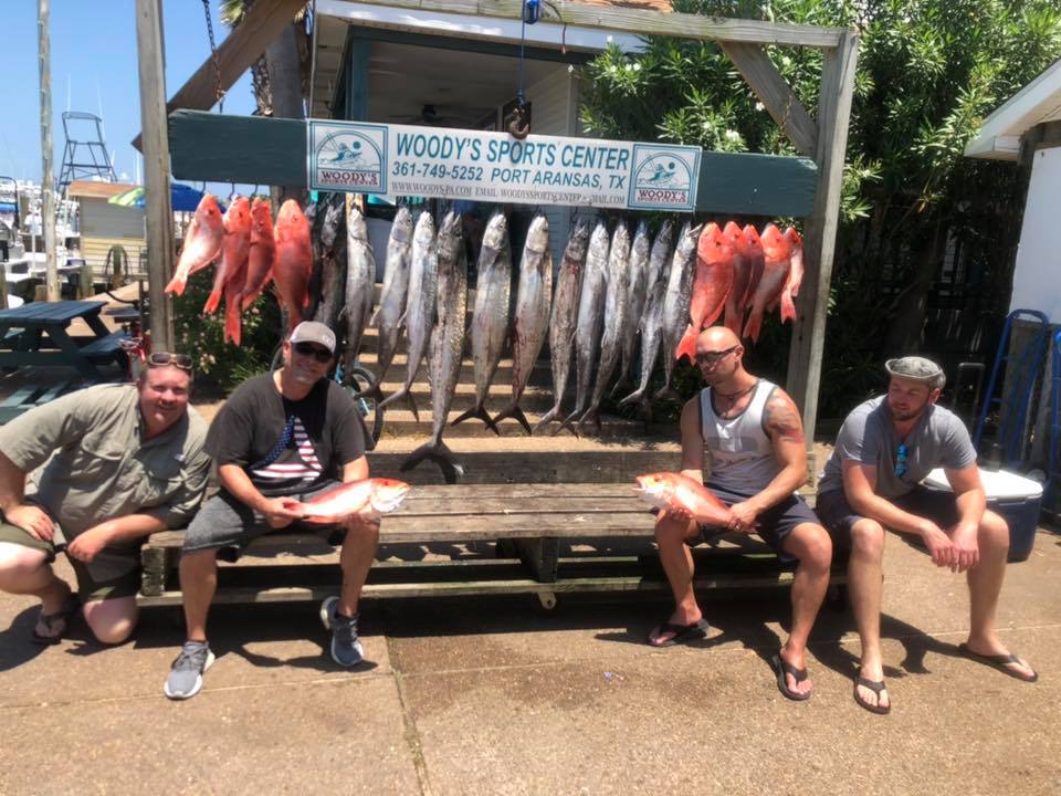 Four people enjoying a fishing tour in Port Aransas