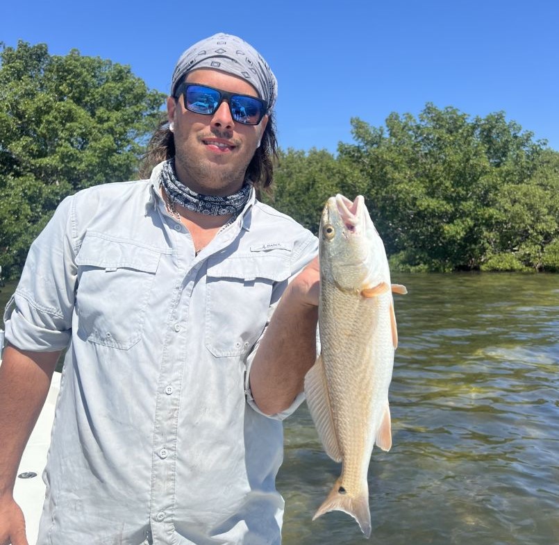 A person fishing at Bradenton Beach
