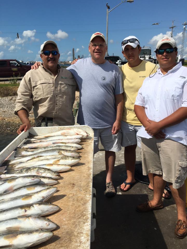 Four people fishing in Galveston