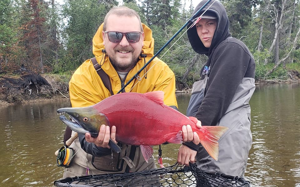 Fishing scene in Koliganek with 2 people
