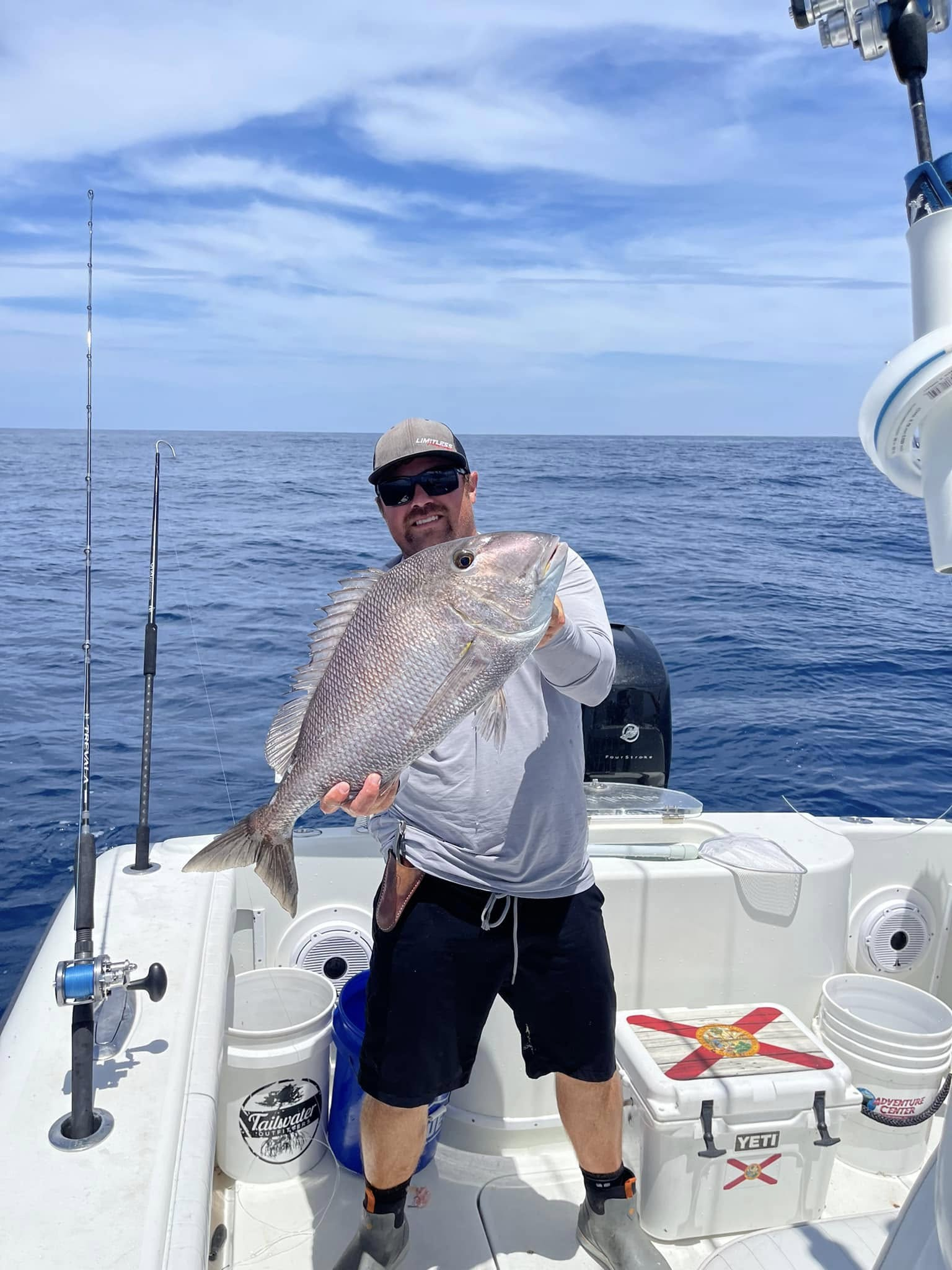 Angler holds a 21-inch fish in Port Orange