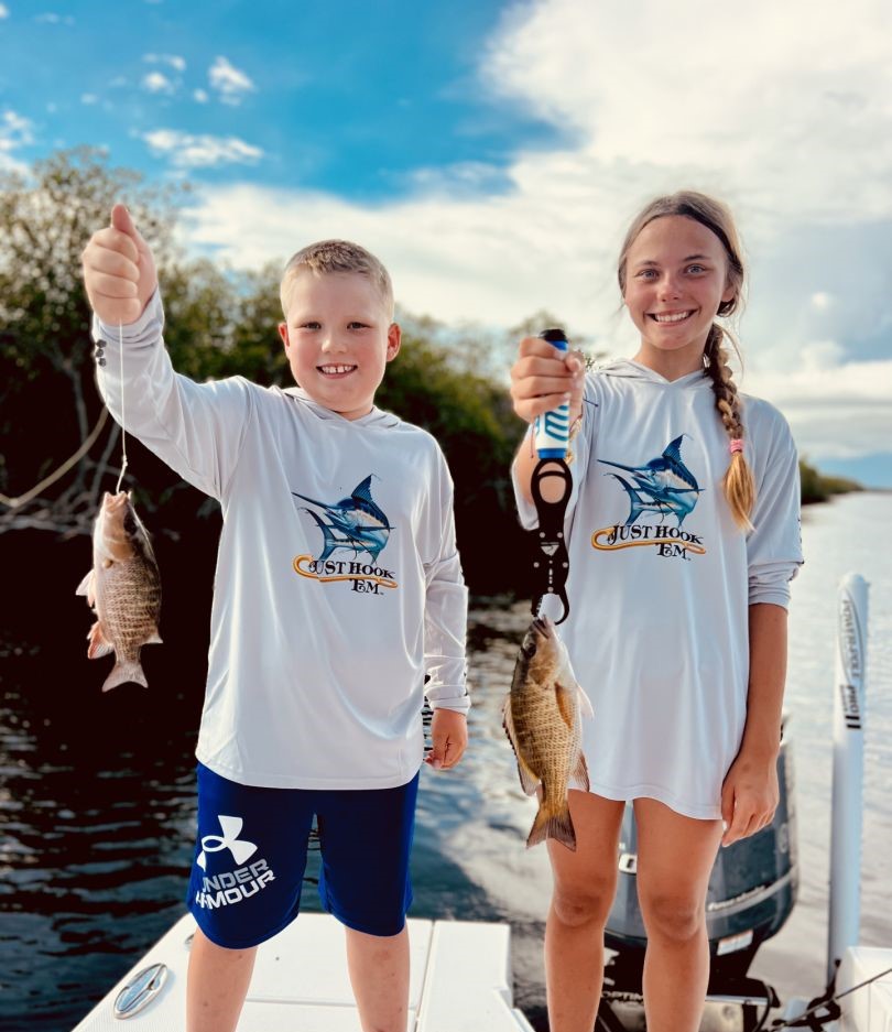 2 fishing enthusiasts reeling in their catch in FL