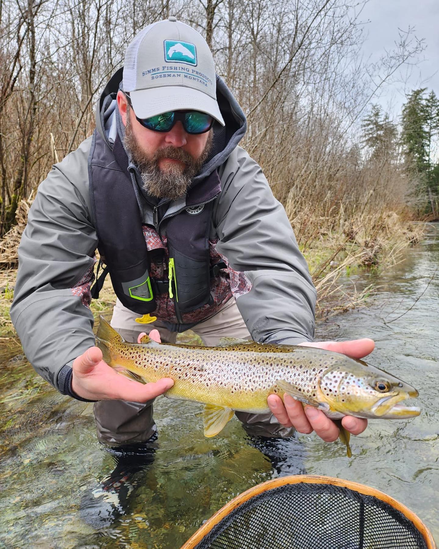 Fisherman catches a 15-inch Sea Trout at Lake Cowichan