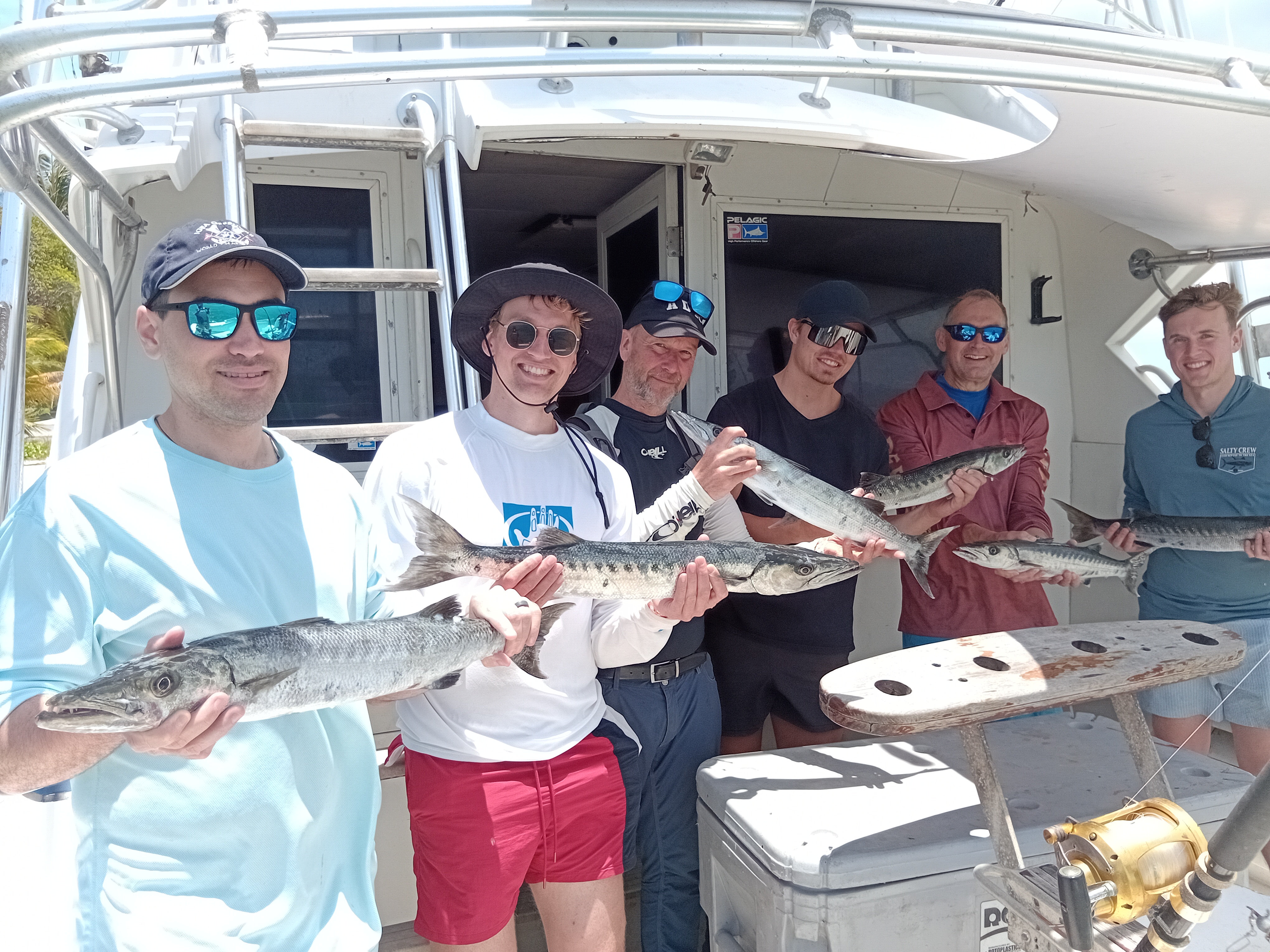 Successful fishing trip at Pigeon Point Beach with multiple Great Barracuda caught on charter boat