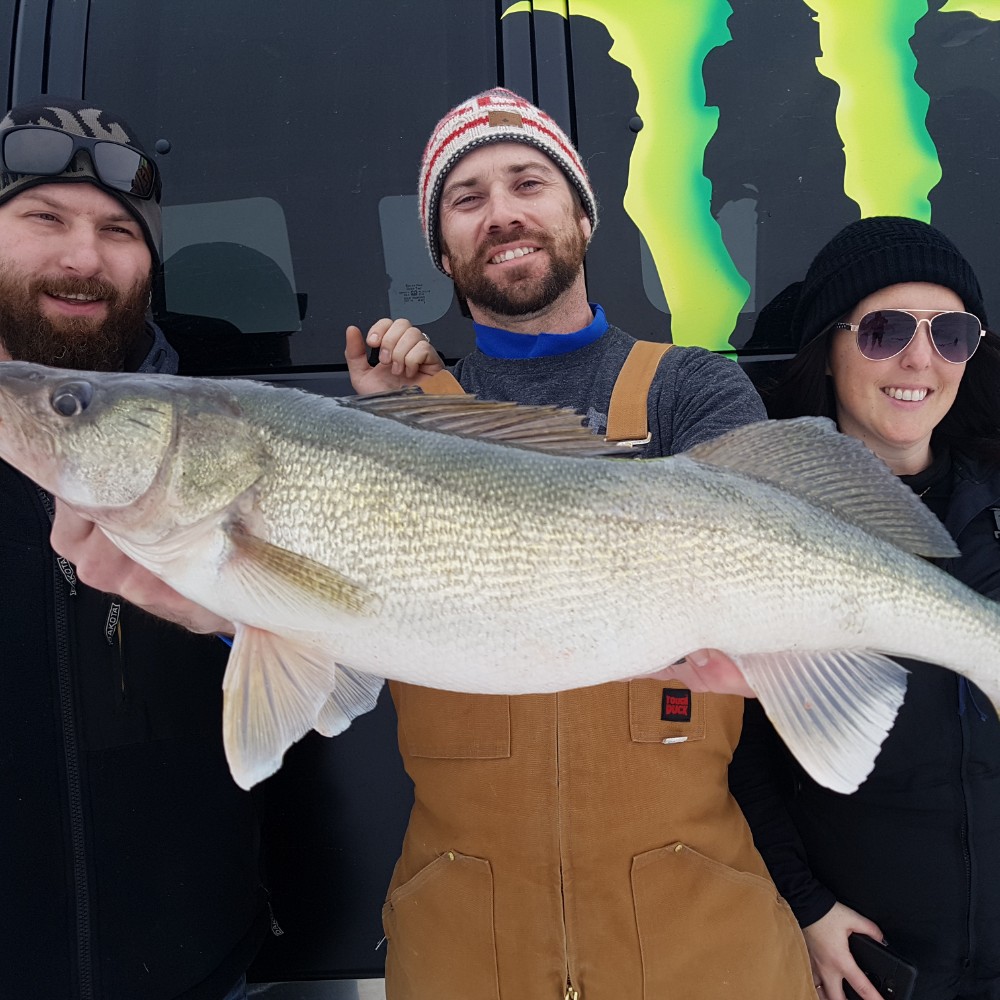 Three people fishing in Manitoba