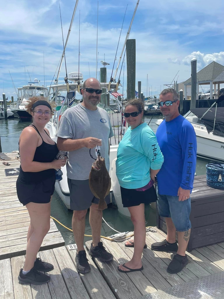 A group of 4 people enjoying a fishing trip in Avalon