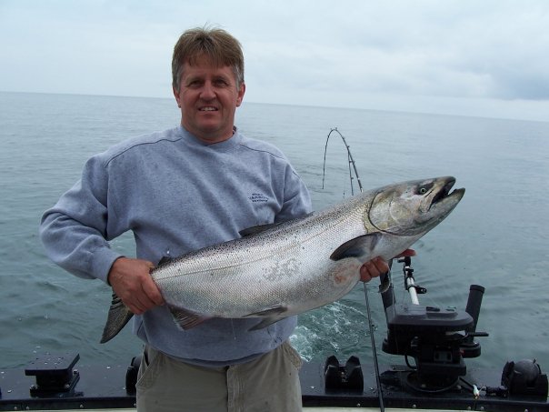 A single angler fishing on the water in ON