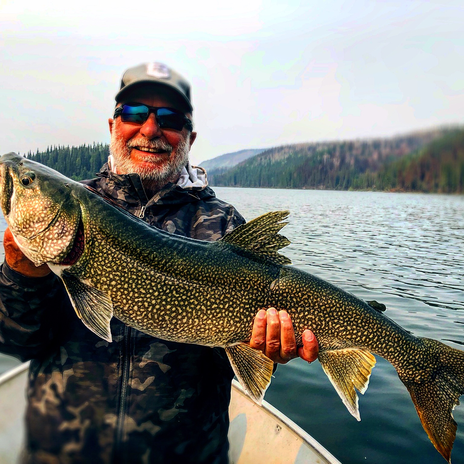 A photo of a 25-inch lake trout caught while fishing in YT.